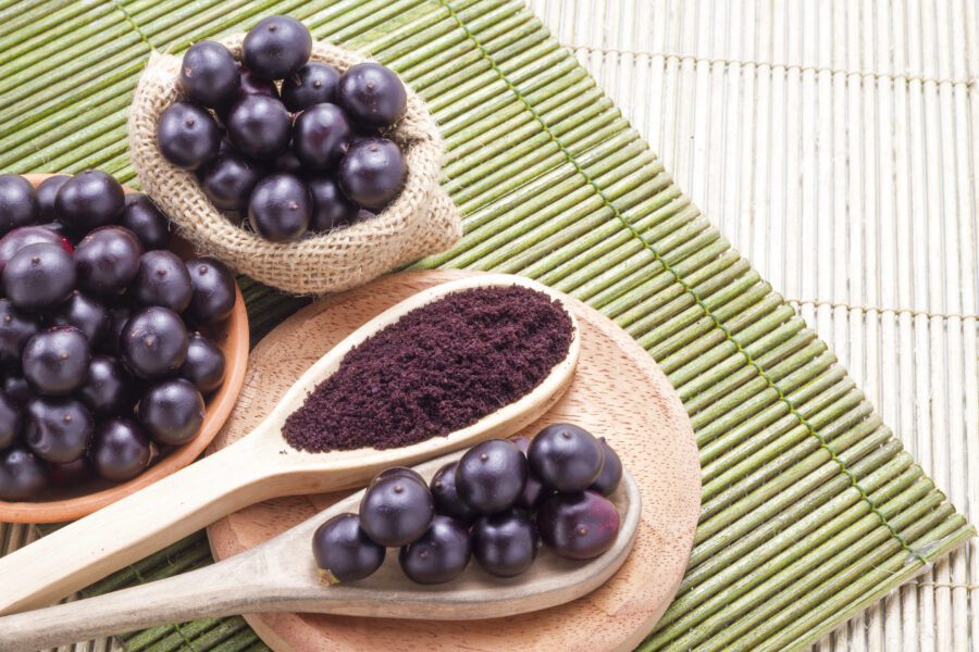 Acai powder and berries on a spoon