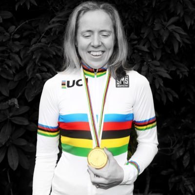 Lora Fachie smiling holding her Olympic gold medal