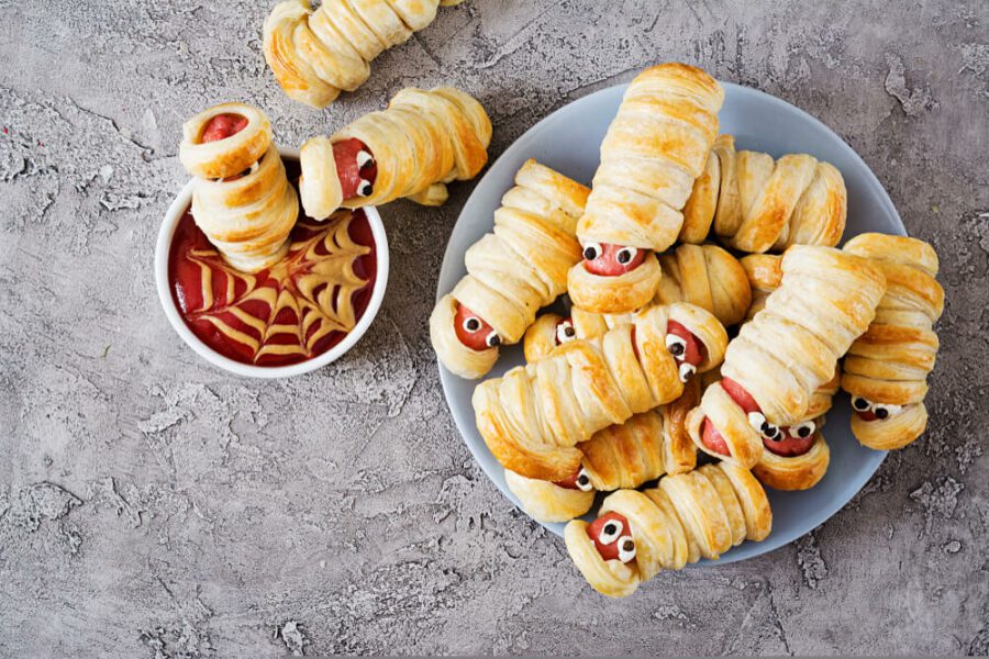 sausage rolls wrapped in strips of pastry
