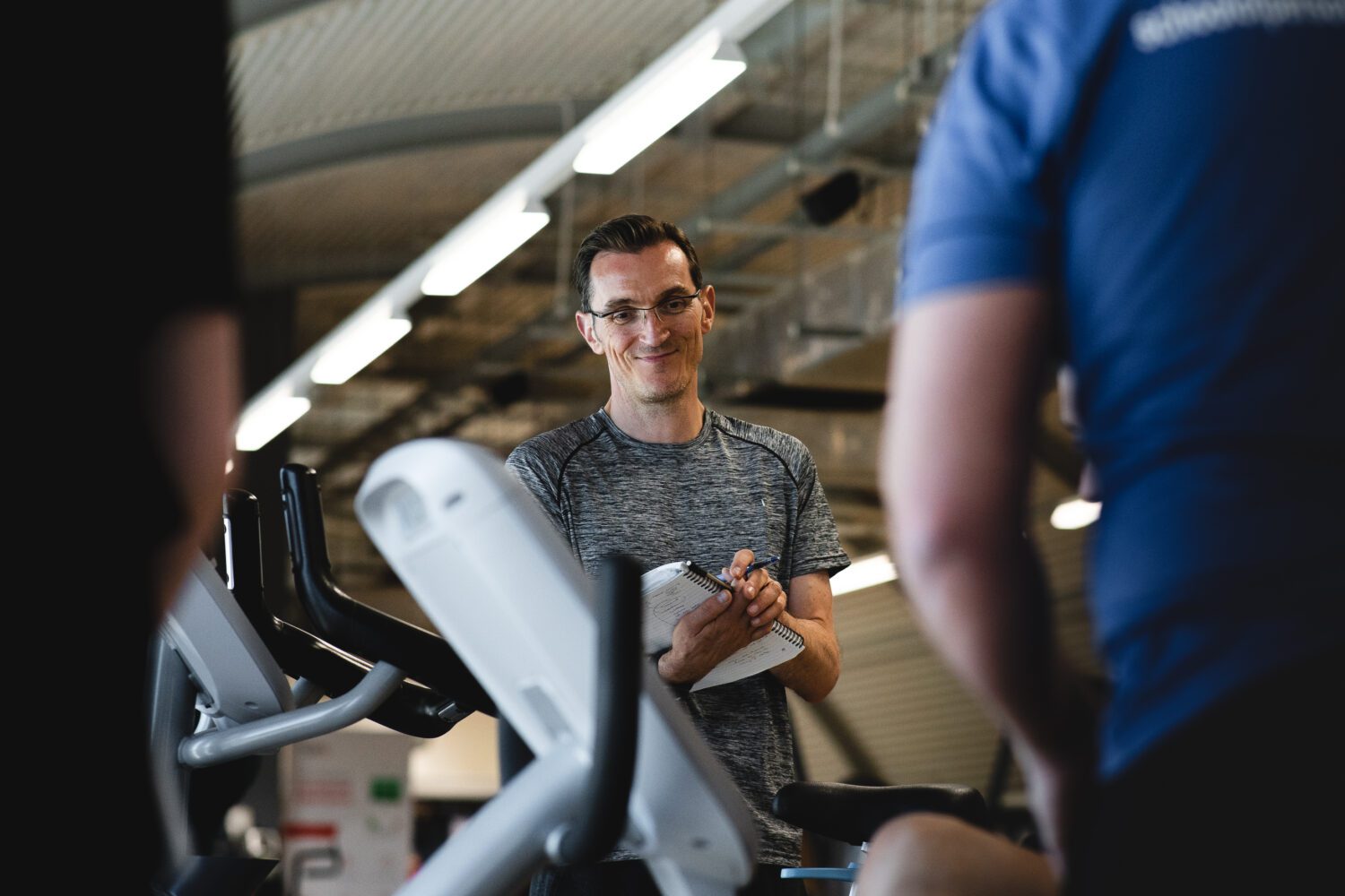 Gym Instructor assessing course student