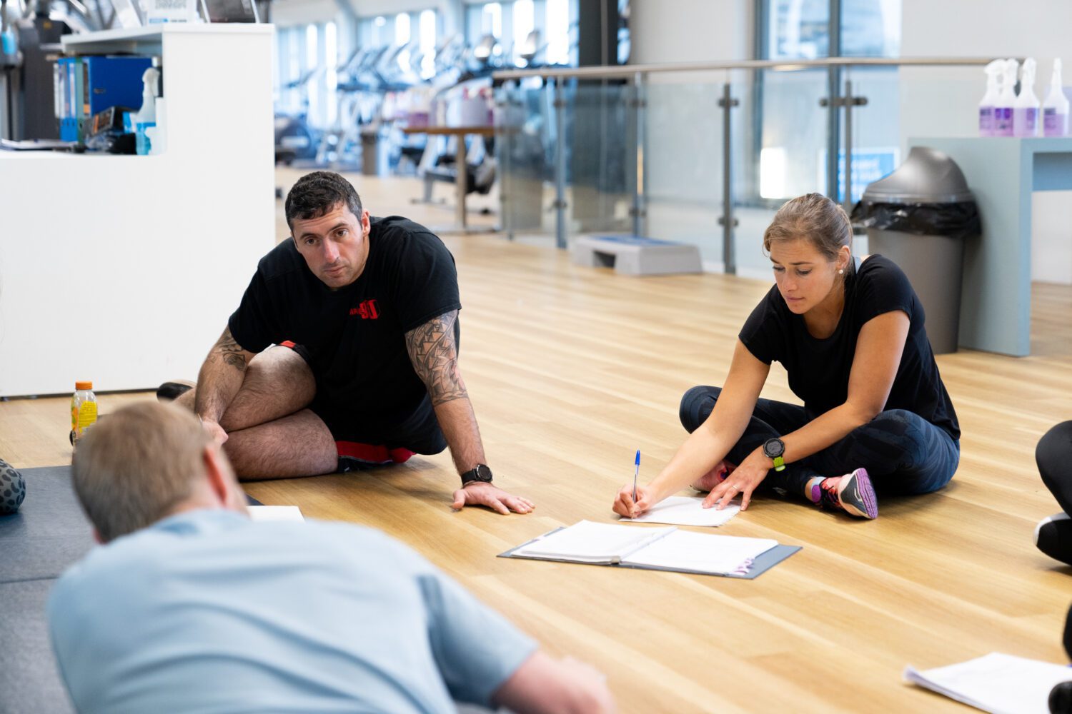 coach working with personal training students