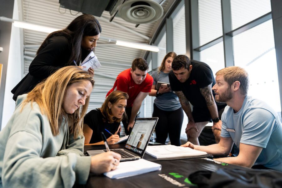 Students learning together on a personal training course