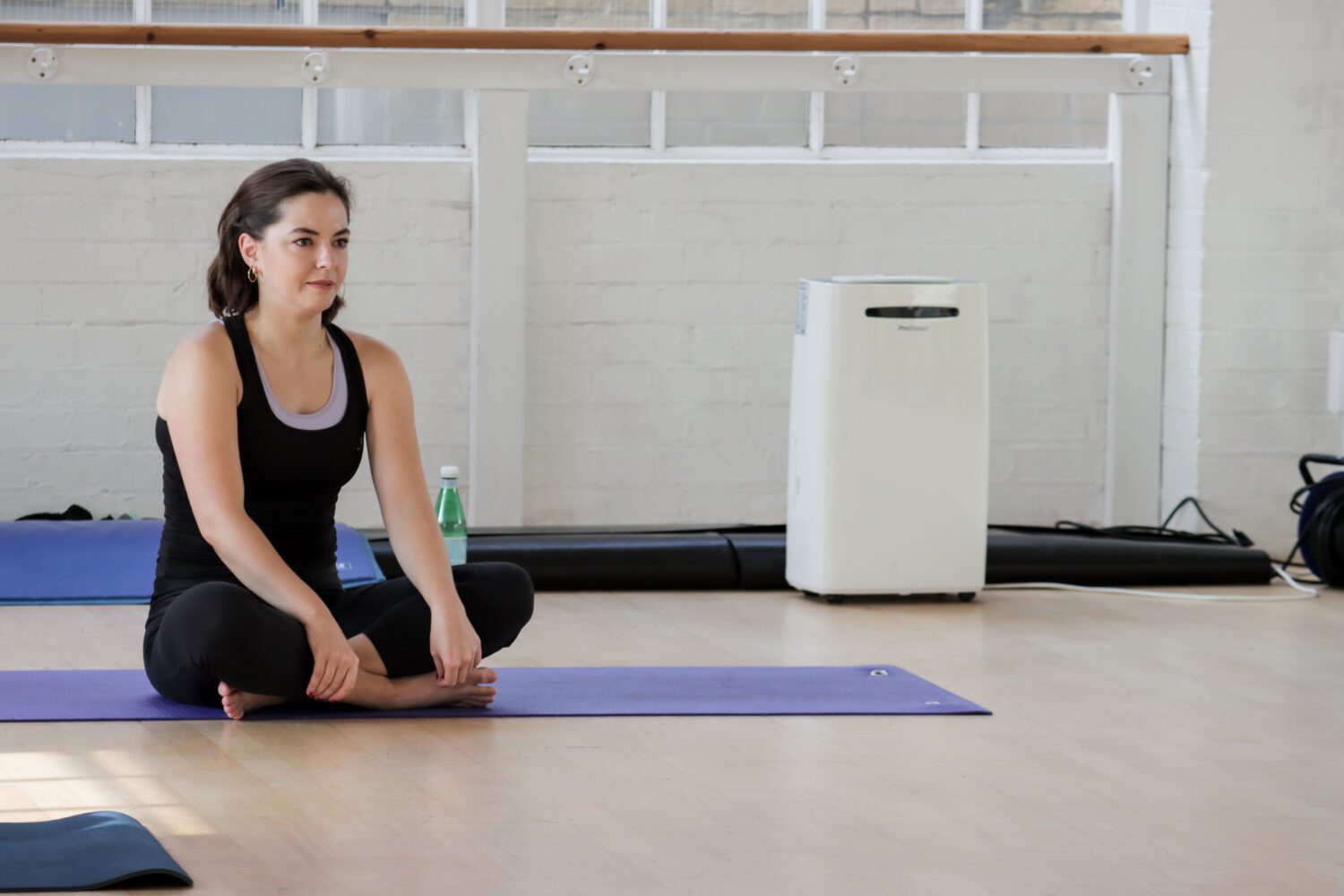 Pilates mat instructor teaching a practical course