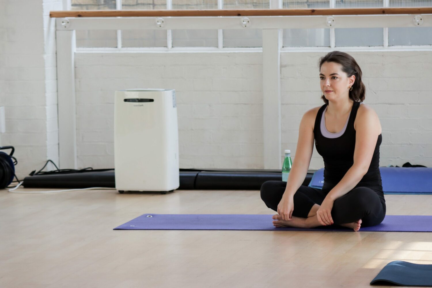 Pilates mat instructor teaching a practical course