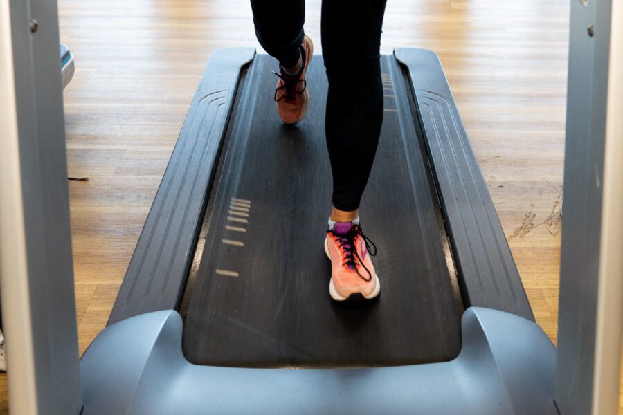 woman's feet running on a treadmill