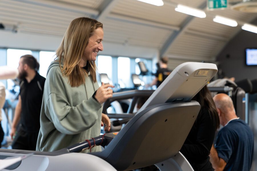 Personal training client on a treadmill