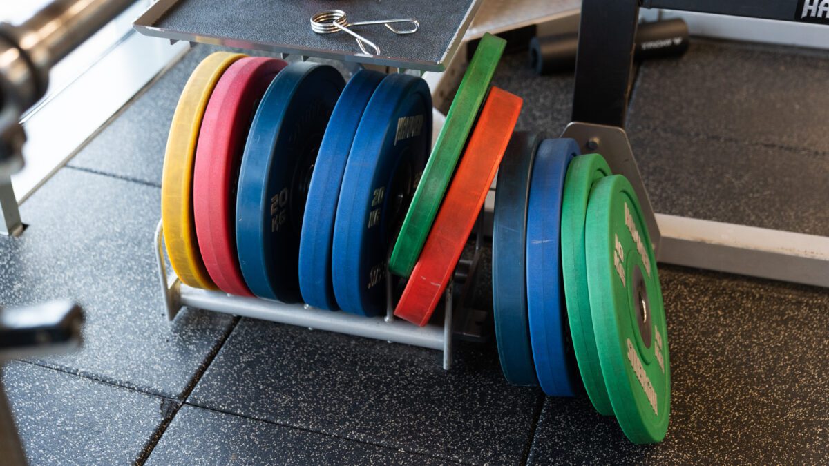 multi coloured weight plates in a row