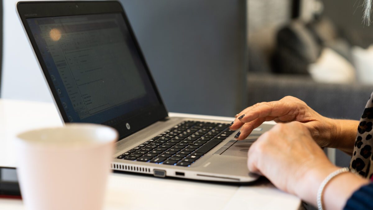 Student completing their course on a laptop