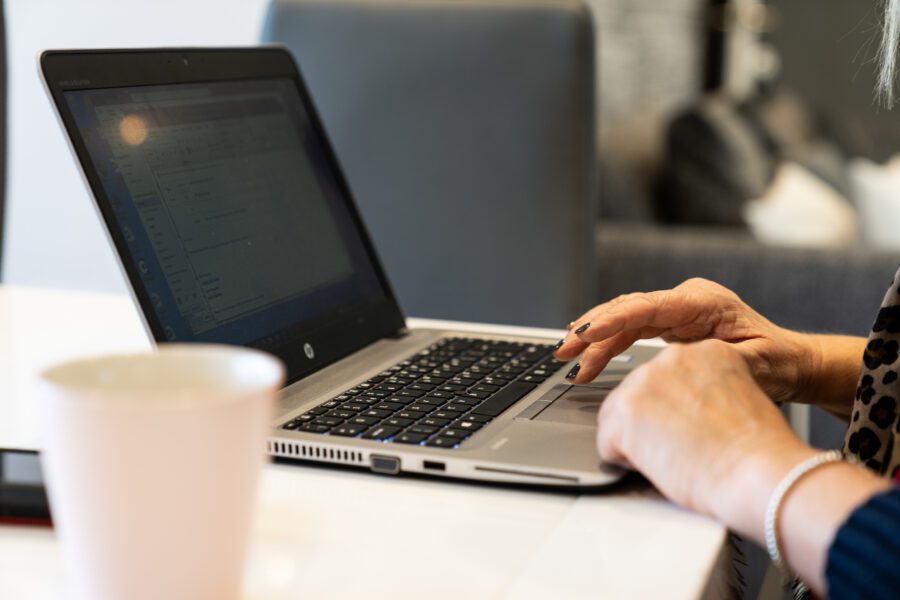 Student completing their course on a laptop