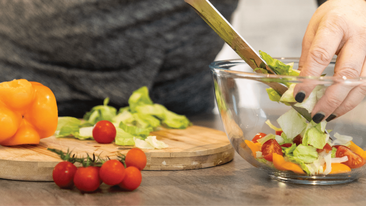 nutrition adviser preparing a salad - future fit nutrition courses