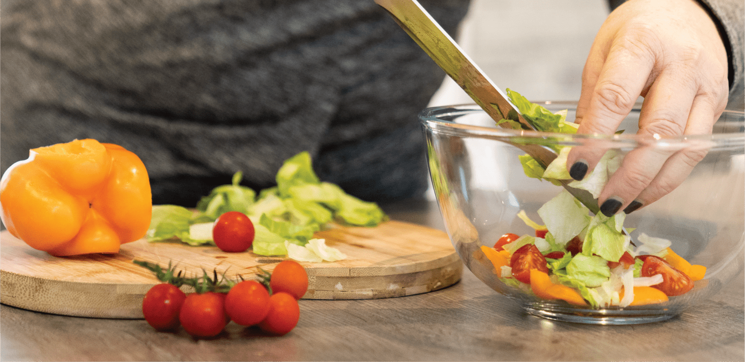 nutrition adviser preparing a salad - future fit nutrition courses