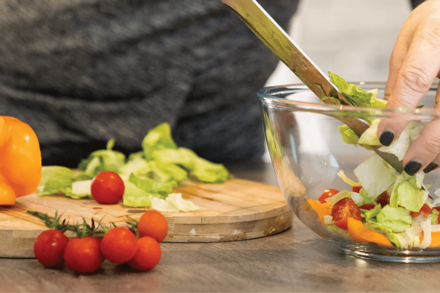 nutrition adviser preparing a salad - future fit nutrition courses