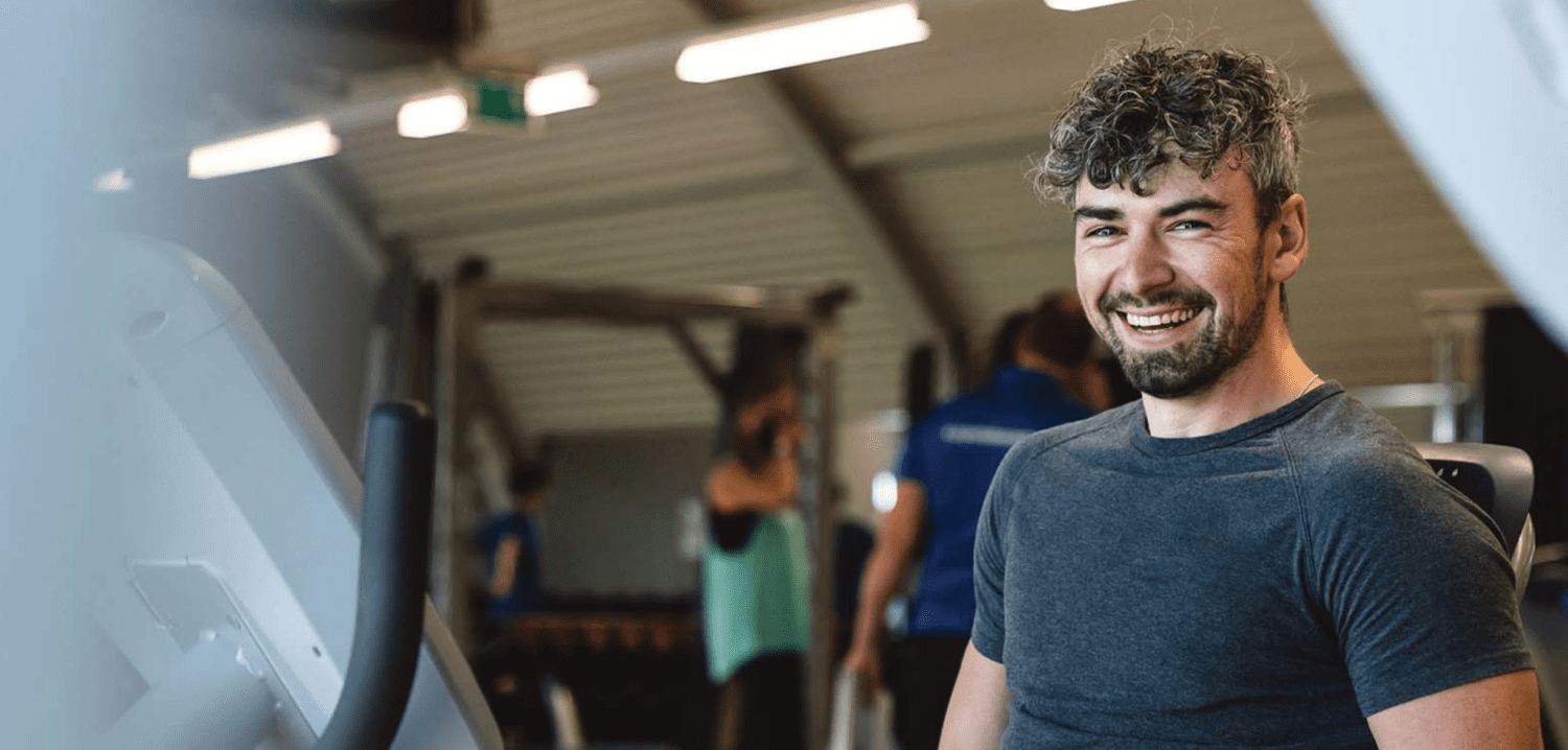 male using gym equipment