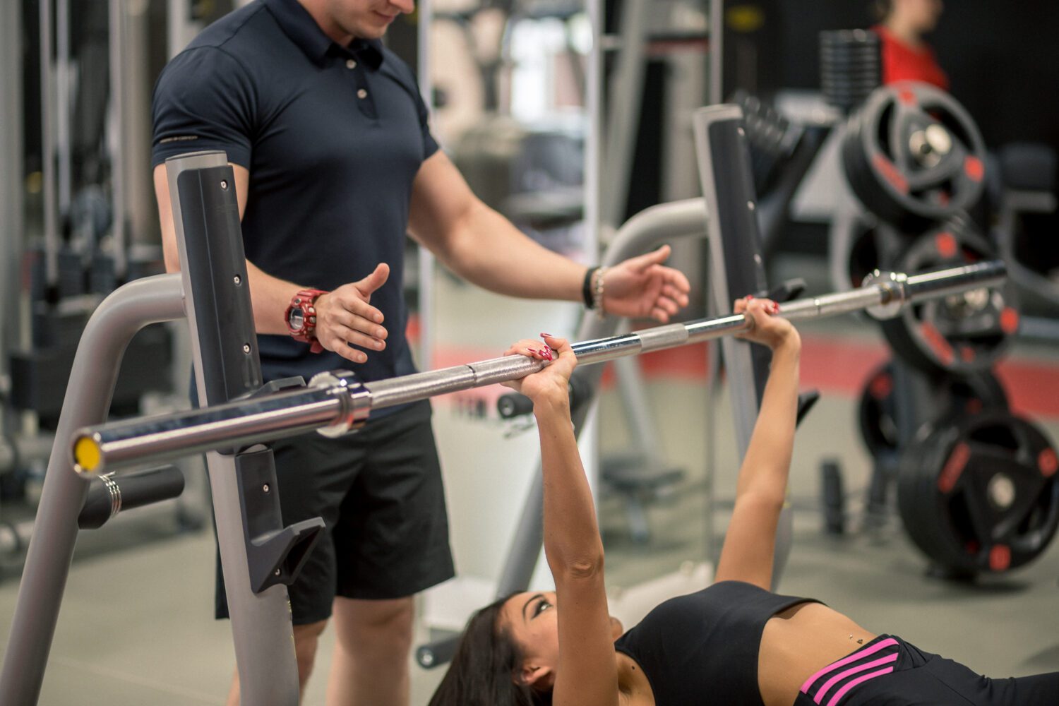 Personal Trainer helping his clients