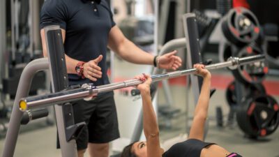 Personal Trainer helping his clients