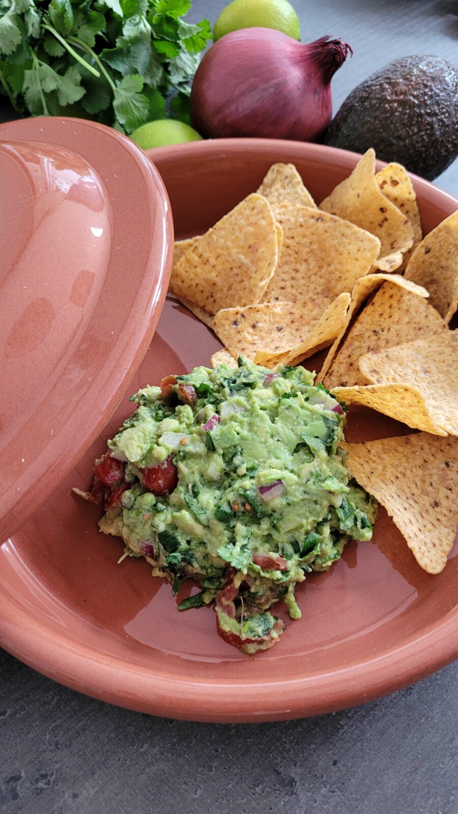 Guacamole and tortilla chips in a bowl