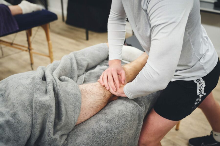 Student giving sports massage therapy