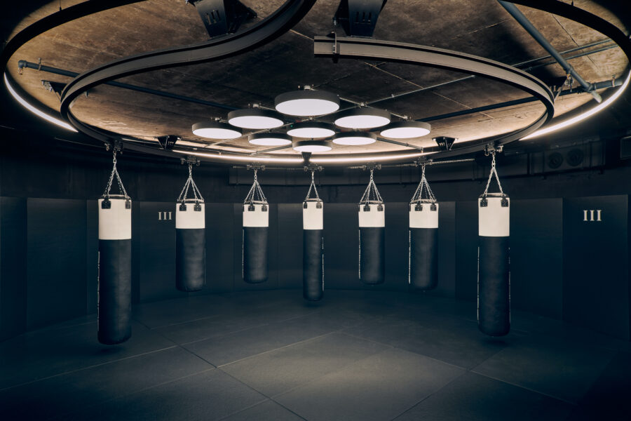 Third Space gym floor showing multiple hanging boxing bags