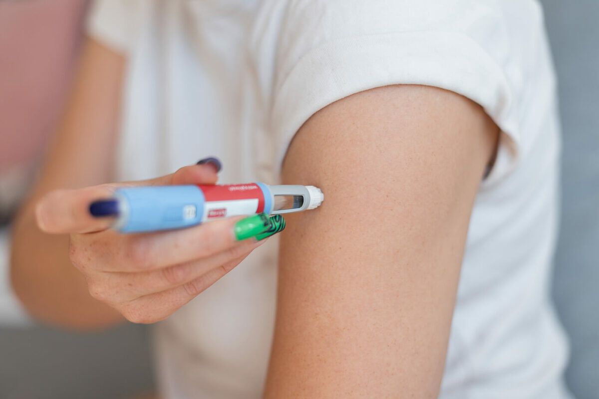 Fitness professional supporting a client using GLP‑1 medication