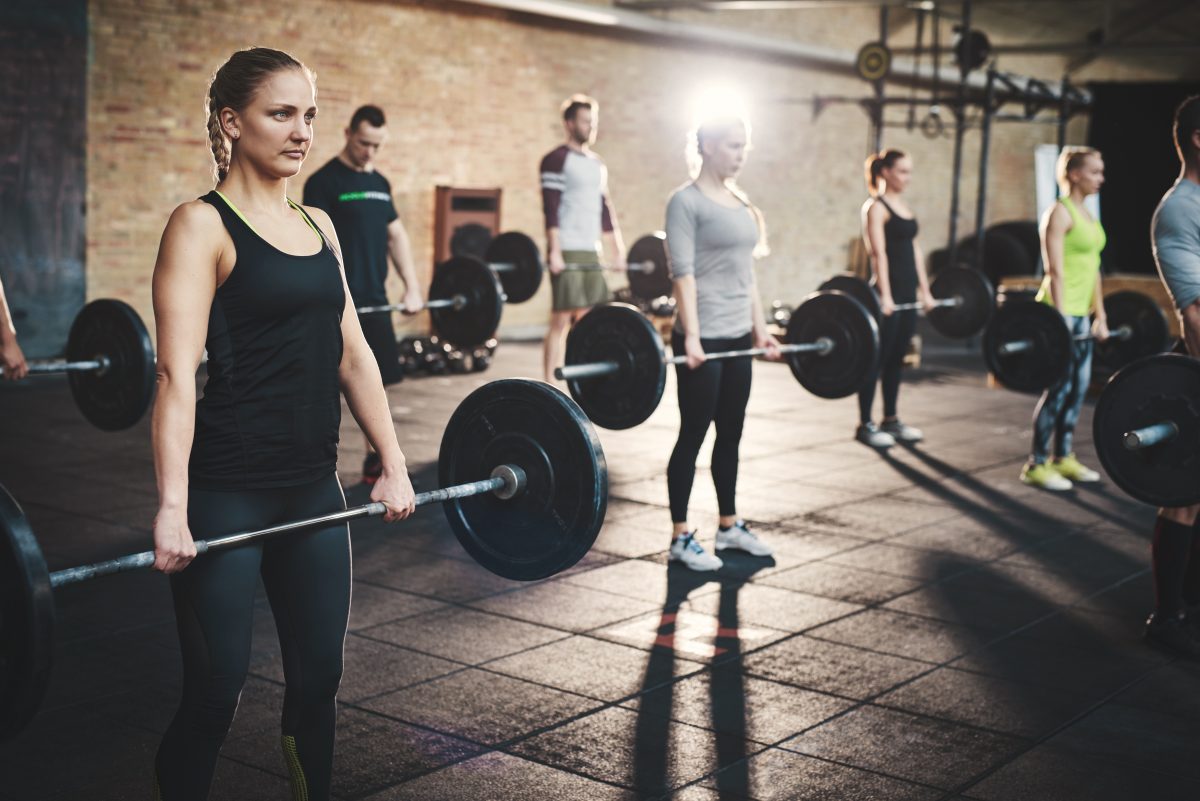 Fitness professional coaching a small group training session